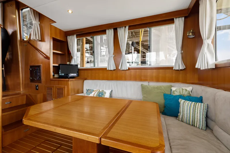 Greymalkin II Yacht Photos Pics Interior of 2008 North Pacific 39 Pilothouse with wood finish and cozy seating area.