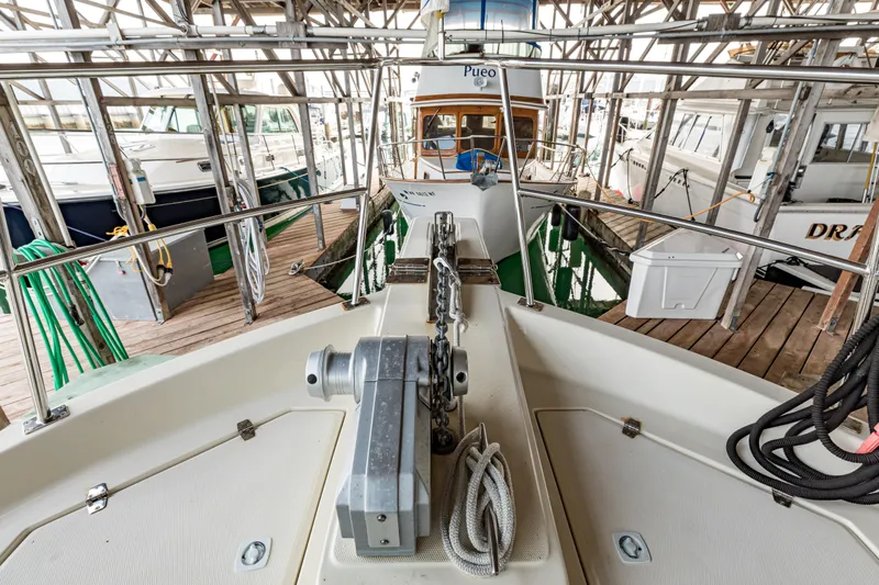 Greymalkin II Yacht Photos Pics 2008 North Pacific 39 Pilothouse docked in a marina, surrounded by other boats.