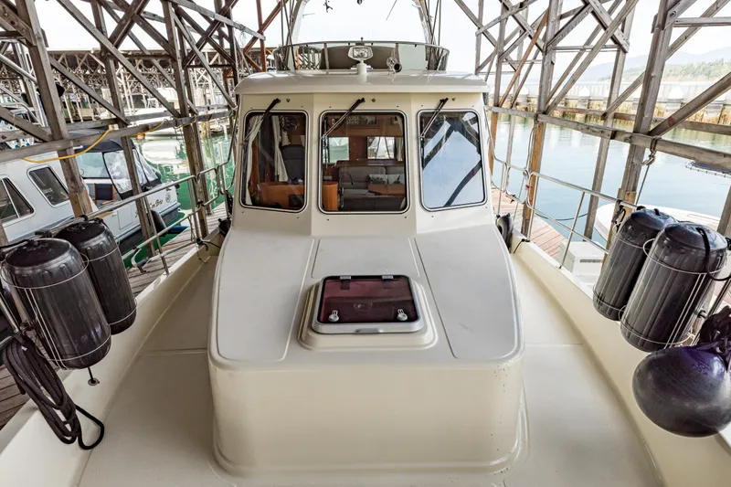Greymalkin II Yacht Photos Pics 2008 North Pacific 39 Pilothouse boat docked in a marina, showcasing its pilothouse design.