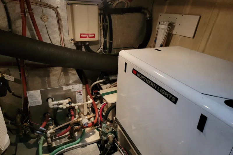 Greymalkin II Yacht Photos Pics Engine room of 2008 North Pacific 39 Pilothouse with Northern Lights generator.