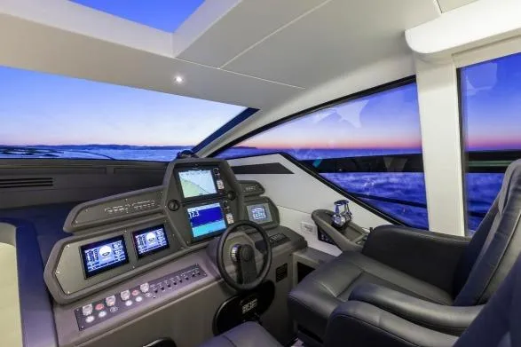  Yacht Photos Pics Luxurious 2016 Pershing 62' yacht cockpit with modern navigation systems and ocean view.