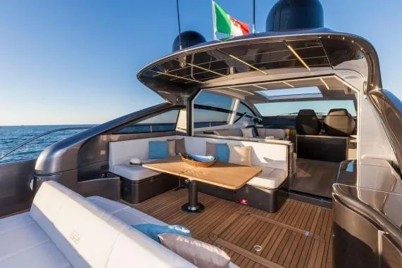  Yacht Photos Pics Luxurious 2016 Pershing 62' yacht with elegant outdoor seating and ocean view.