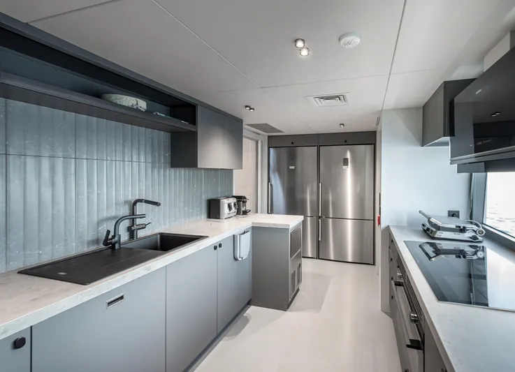 Numarine 30xp Yacht Photos Pics Modern kitchen interior on 2025 Numarine 30XP yacht, featuring sleek appliances and minimalist design.