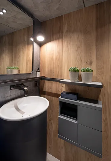 Numarine 30xp Yacht Photos Pics Modern bathroom in 2025 Numarine 30XP yacht with wood paneling and sleek fixtures.