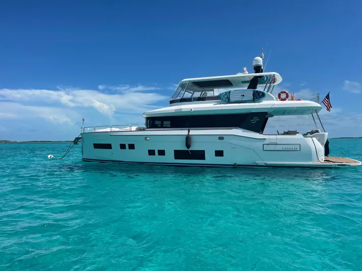 Fantasea Yacht Photos Pics Luxury Sirena 64 yacht from 2020 on turquoise waters under clear blue sky.