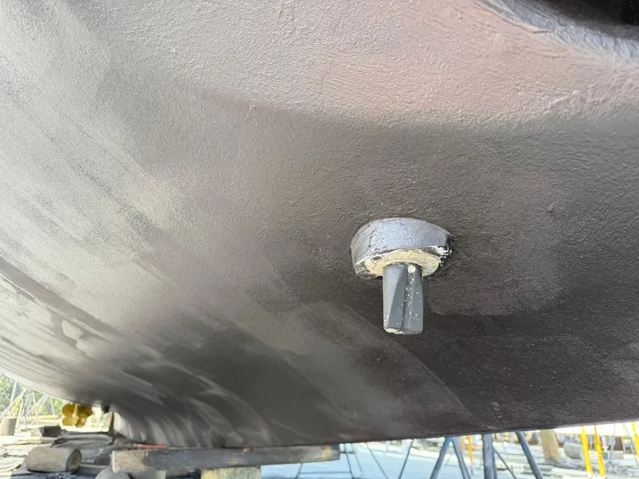 Fantasea Yacht Photos Pics Close-up of a 2020 Sirena 64 yacht hull with a protruding fitting.