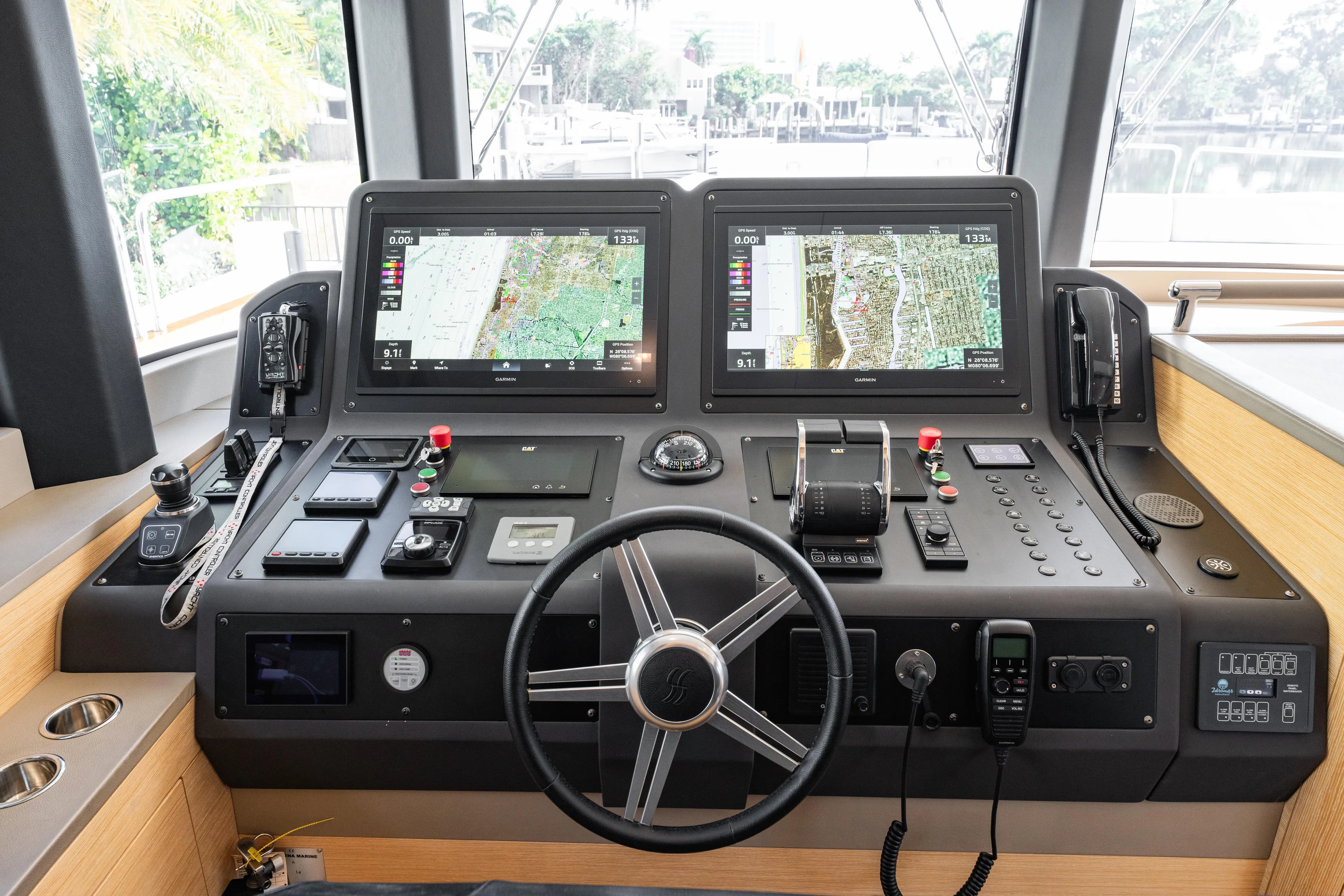Fantasea Yacht Photos Pics Helm of 2020 Sirena 64 yacht with dual navigation screens and controls.