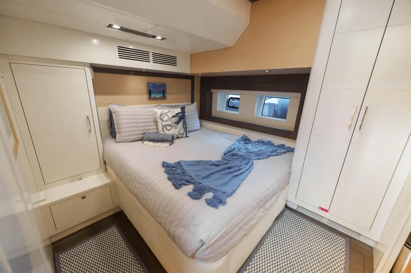 Fantasea Yacht Photos Pics Luxurious bedroom interior of 2020 Sirena 64 yacht with elegant bedding and modern design.
