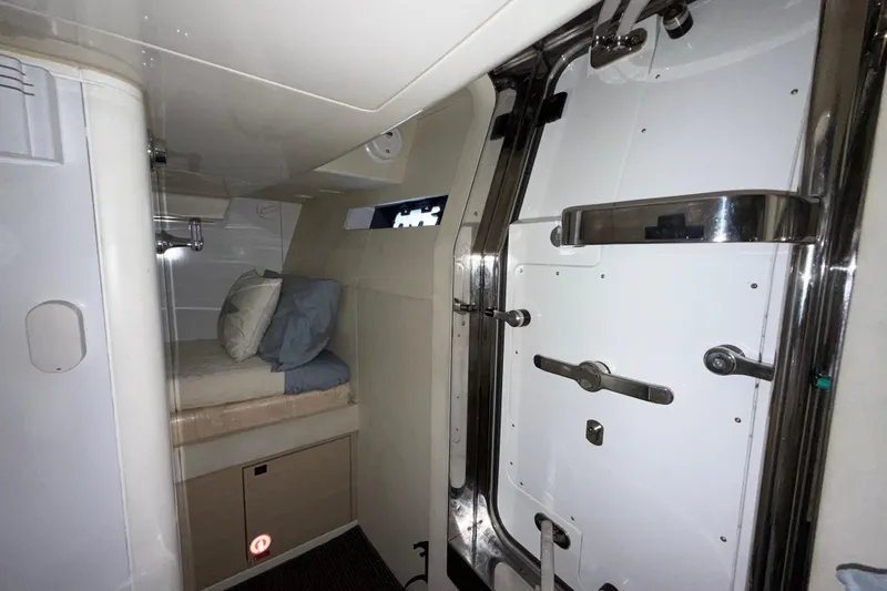 Fantasea Yacht Photos Pics 2020 Sirena 64 yacht interior with cozy bed and sleek modern design.