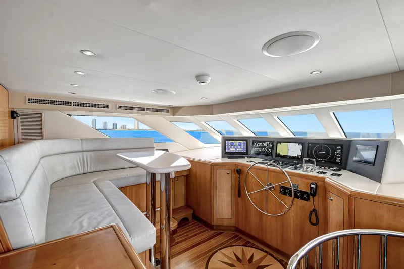 Danielle Yacht Photos Pics Luxurious 2005 Hatteras Semi-Displacement yacht interior with modern helm and panoramic windows.