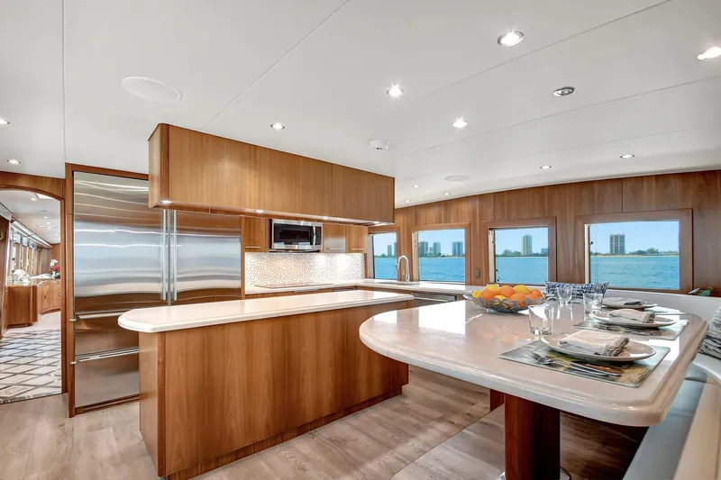 Danielle Yacht Photos Pics Luxurious 2005 Hatteras Semi-Displacement yacht interior with modern kitchen and scenic ocean views.