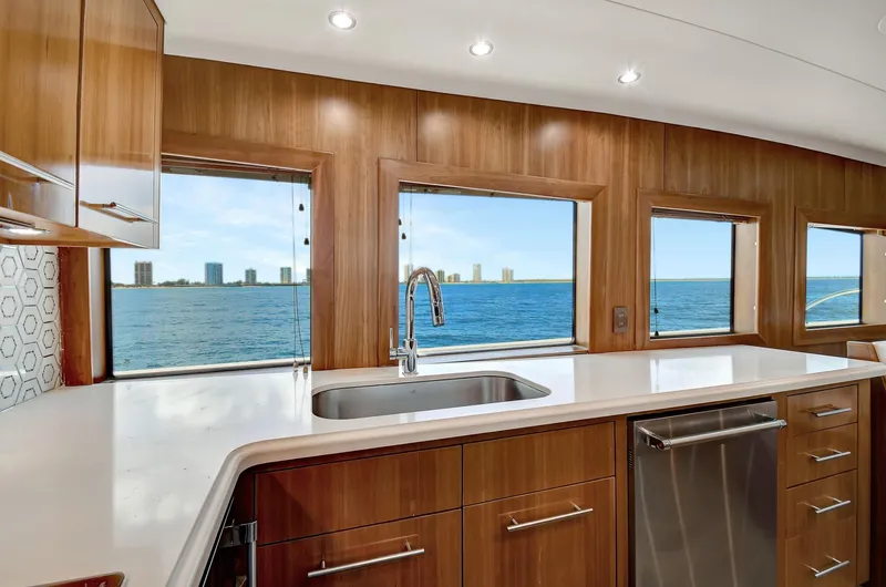 Danielle Yacht Photos Pics Luxurious kitchen interior of 2005 Hatteras Semi-Displacement yacht with ocean view.