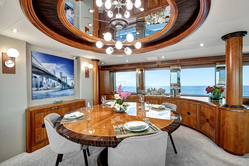 Danielle Yacht Photos Pics Luxurious dining area on 2005 Hatteras Semi-Displacement yacht with ocean view and elegant decor.
