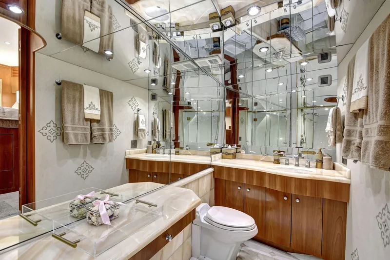 Danielle Yacht Photos Pics Luxurious bathroom in 2005 Hatteras Semi-Displacement yacht with elegant fixtures and mirrored walls.