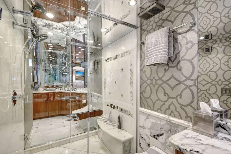 Danielle Yacht Photos Pics Luxurious bathroom on 2005 Hatteras Semi-Displacement yacht with marble and elegant fixtures.