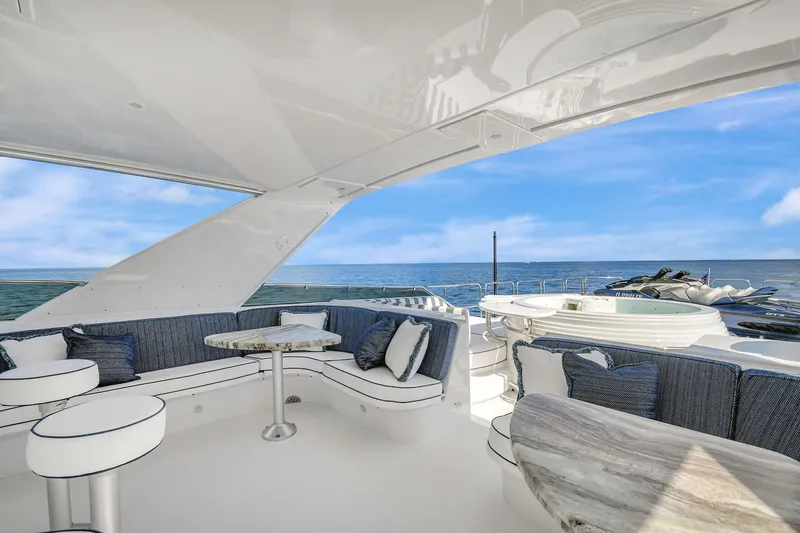 Danielle Yacht Photos Pics Luxurious 2005 Hatteras Semi-Displacement yacht with elegant seating and ocean view.