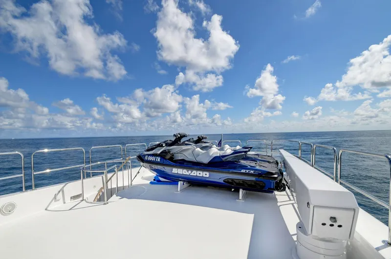 Danielle Yacht Photos Pics 2005 Hatteras Semi-Displacement yacht deck with Sea-Doo jet ski, ocean view.