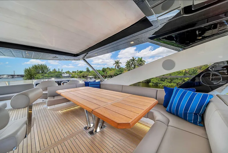  Yacht Photos Pics Luxurious Sunseeker 86 yacht deck with elegant seating and wooden table, 2019 model.