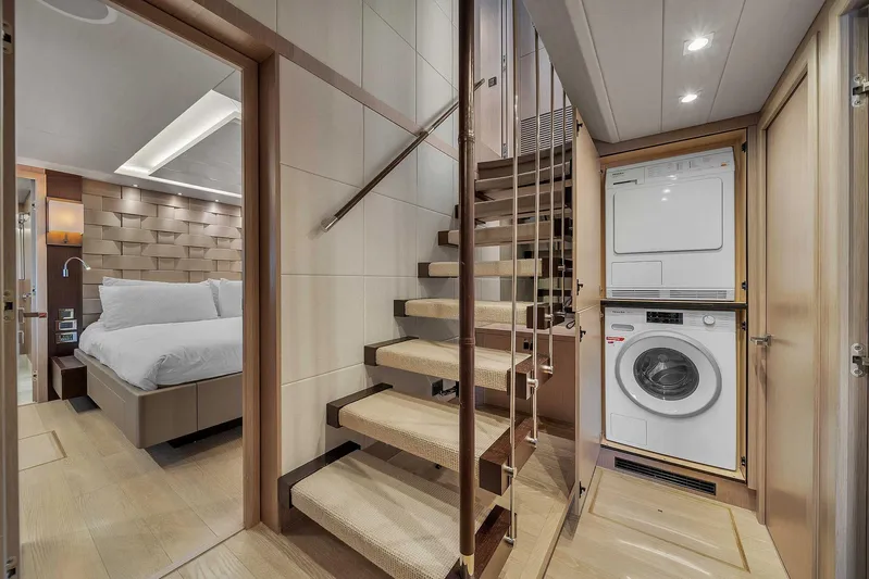  Yacht Photos Pics Luxurious Sunseeker 86 yacht interior with staircase, bedroom, and laundry area, 2019 model.