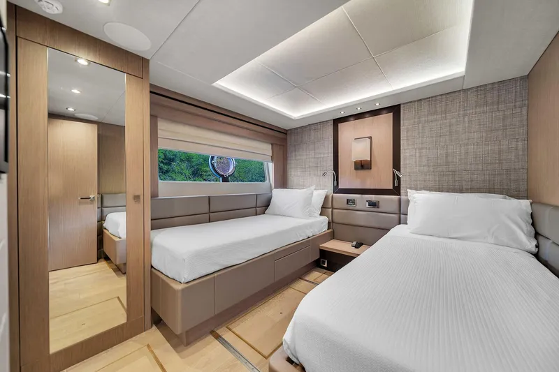  Yacht Photos Pics Luxurious twin bedroom in 2019 Sunseeker 86 yacht, featuring modern design and elegant decor.