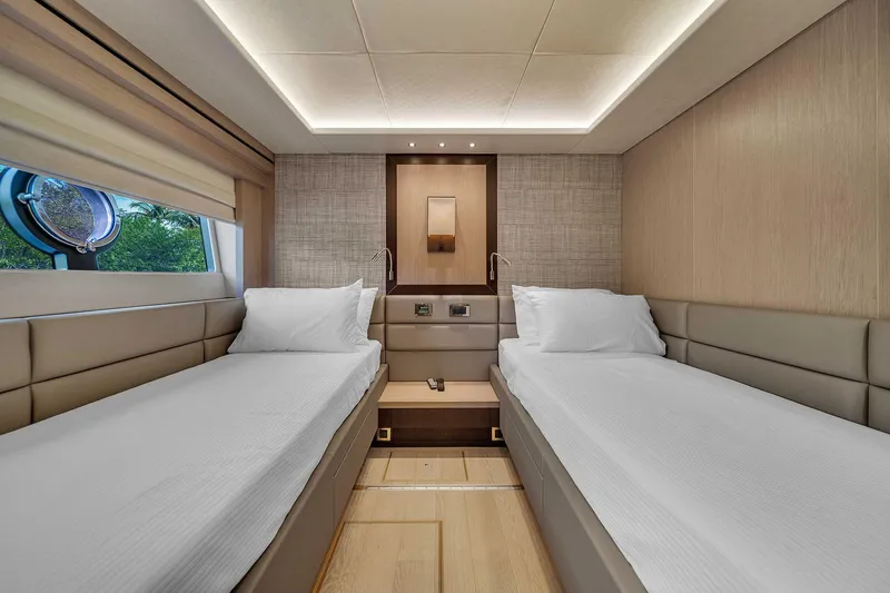  Yacht Photos Pics Luxurious twin cabin interior of 2019 Sunseeker 86 yacht, featuring modern design and comfort.