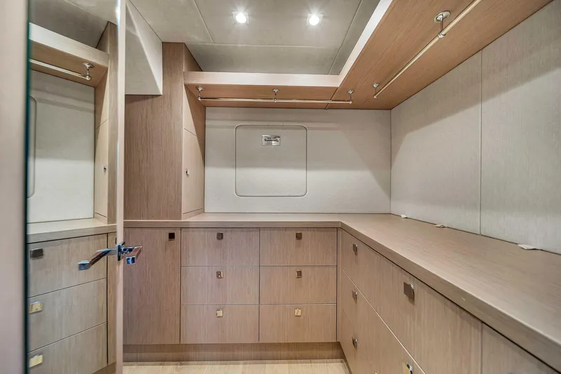  Yacht Photos Pics Spacious Sunseeker 86 yacht interior closet with wooden cabinetry, 2019 model.