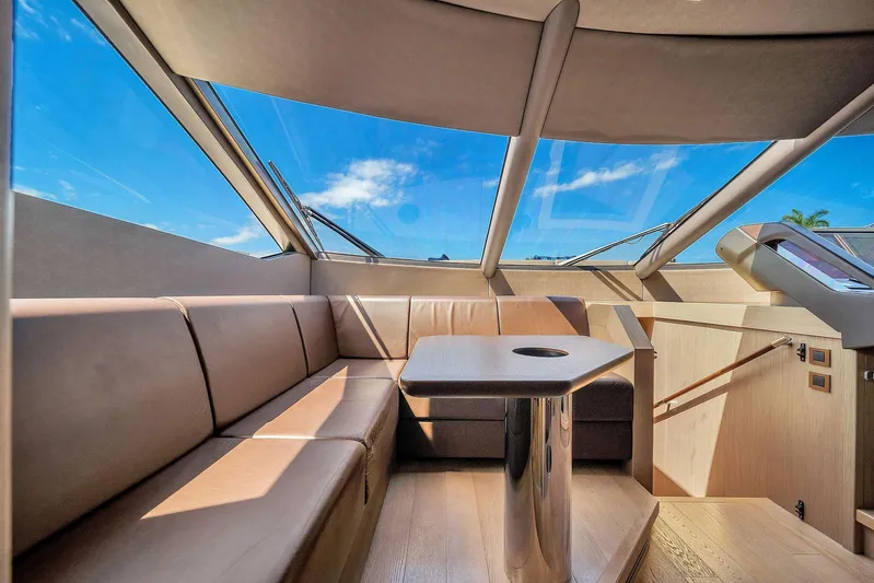  Yacht Photos Pics Luxurious interior of 2019 Sunseeker 86 yacht with panoramic windows and plush seating.