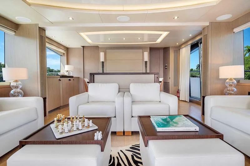  Yacht Photos Pics Luxurious interior of 2019 Sunseeker 86 yacht with elegant seating and chess set.