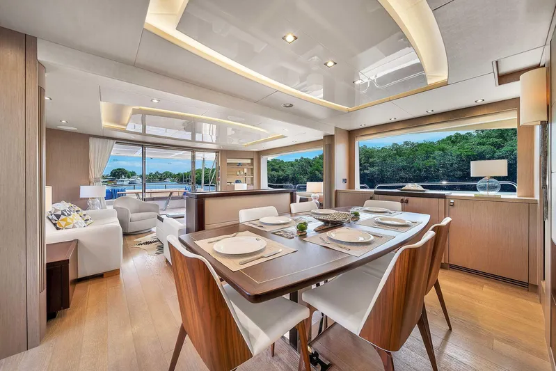  Yacht Photos Pics Luxurious interior of 2019 Sunseeker 86 yacht with elegant dining area and scenic views.
