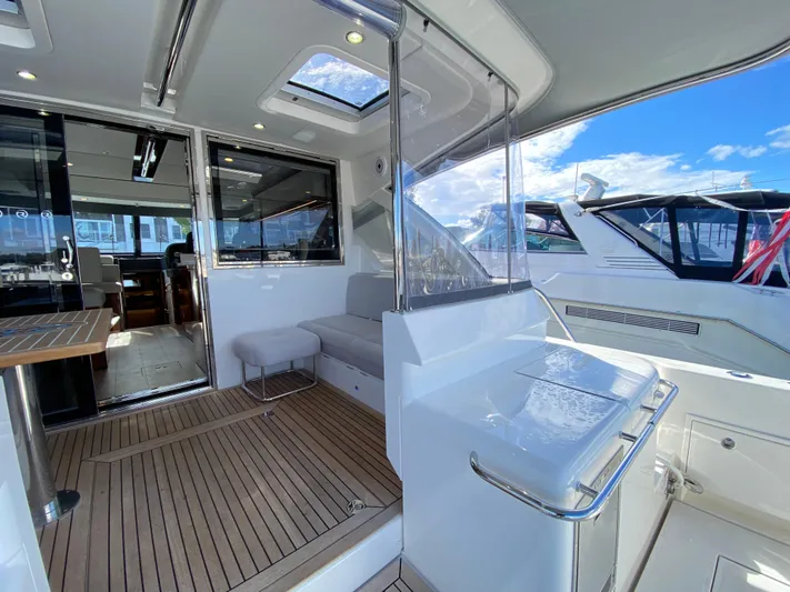  Yacht Photos Pics Luxurious 2025 Riviera 465 SUV yacht interior with sleek design and spacious deck.