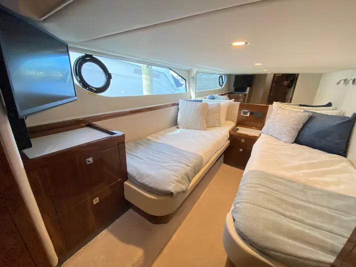  Yacht Photos Pics Luxurious interior of 2025 Riviera 465 SUV yacht with twin beds and modern amenities.