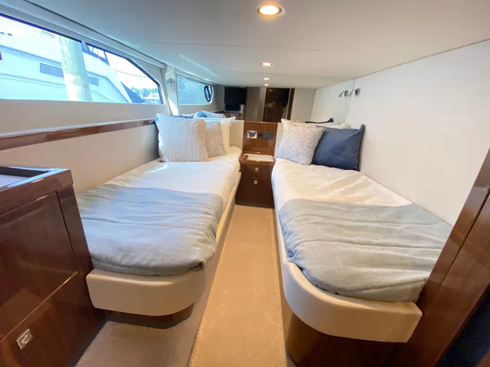  Yacht Photos Pics Interior of 2025 Riviera 465 SUV yacht with twin beds and modern design.