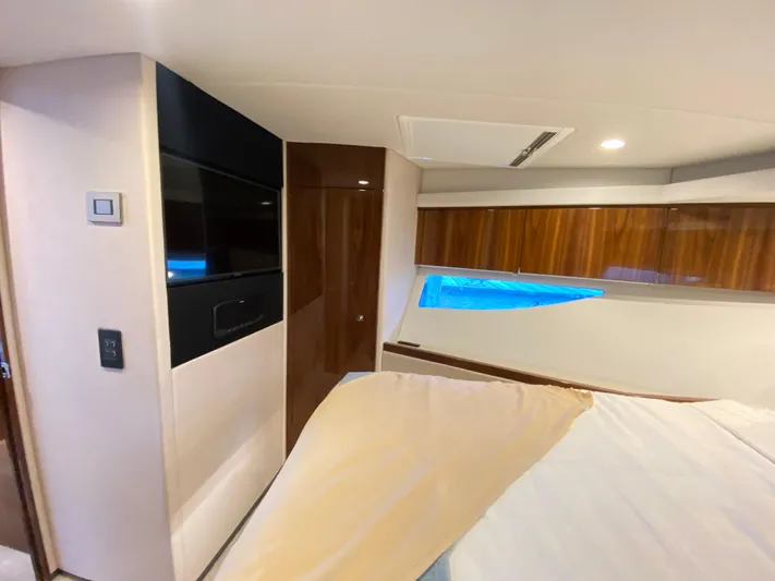  Yacht Photos Pics Interior of 2025 Riviera 465 SUV yacht, featuring modern design and wood accents.