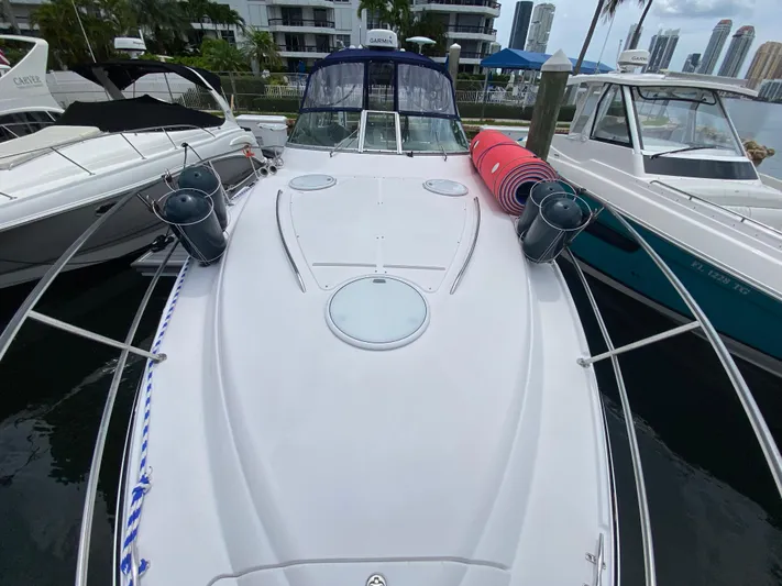  Yacht Photos Pics 2006 Four Winns 348 Vista boat docked, with fenders and rolled mats on deck.