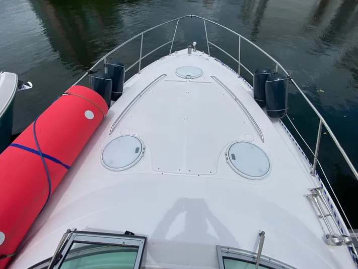  Yacht Photos Pics Bow view of 2006 Four Winns 348 Vista boat with red fender on deck.