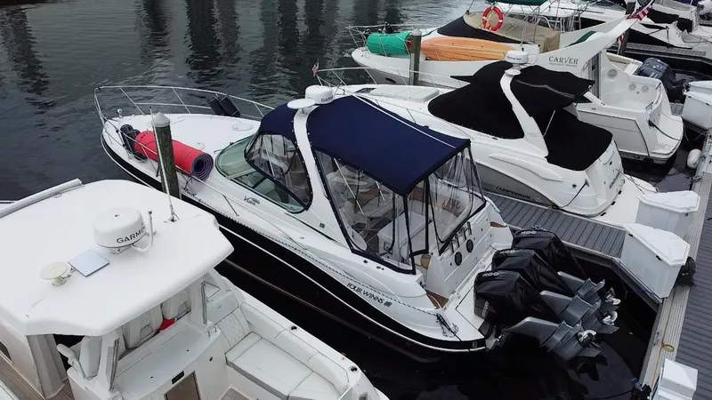  Yacht Photos Pics 2006 Four Winns 348 Vista boat docked at marina with other vessels.