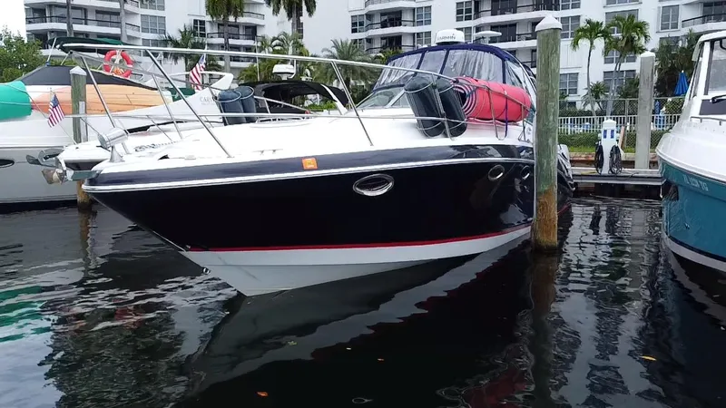  Yacht Photos Pics 2006 Four Winns 348 Vista boat docked in marina, surrounded by water and buildings.