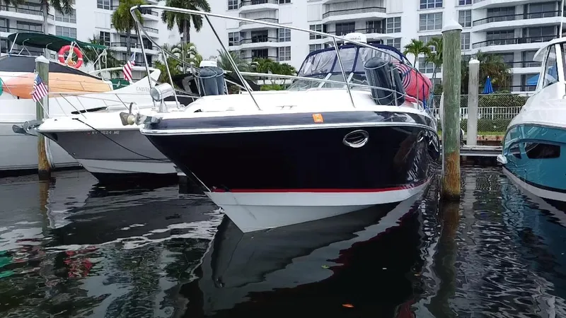  Yacht Photos Pics 2006 Four Winns 348 Vista boat docked in marina, surrounded by other vessels.