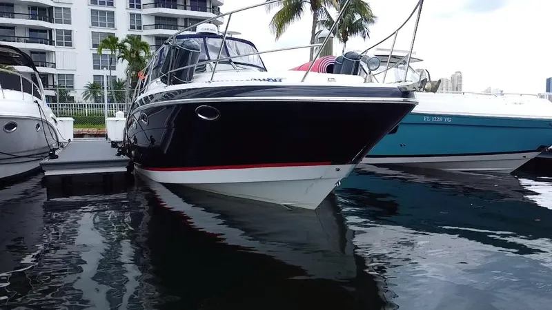  Yacht Photos Pics 2006 Four Winns 348 Vista boat docked near waterfront buildings.