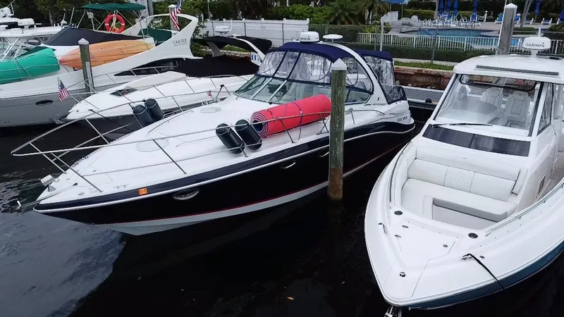  Yacht Photos Pics 2006 Four Winns 348 Vista yacht docked alongside other boats in a marina.