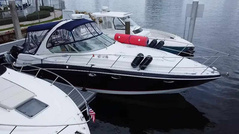  Yacht Photos Pics 2006 Four Winns 348 Vista boat docked at marina, featuring sleek design and canopy.