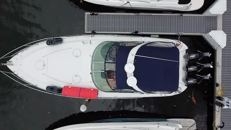  Yacht Photos Pics Aerial view of a 2006 Four Winns 348 Vista boat docked at a marina.