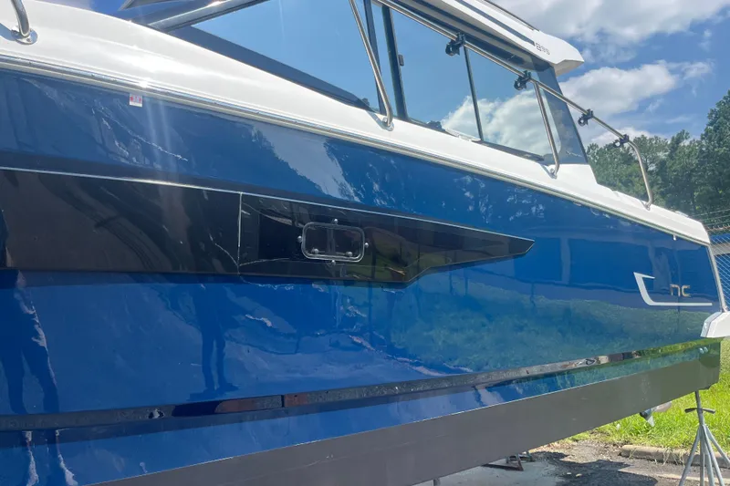  Yacht Photos Pics 2020 Jeanneau NC 895 boat with sleek blue exterior and modern design.