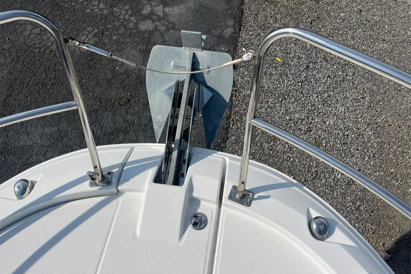  Yacht Photos Pics Bow view of 2020 Jeanneau NC 895 boat with anchor and stainless steel railings.