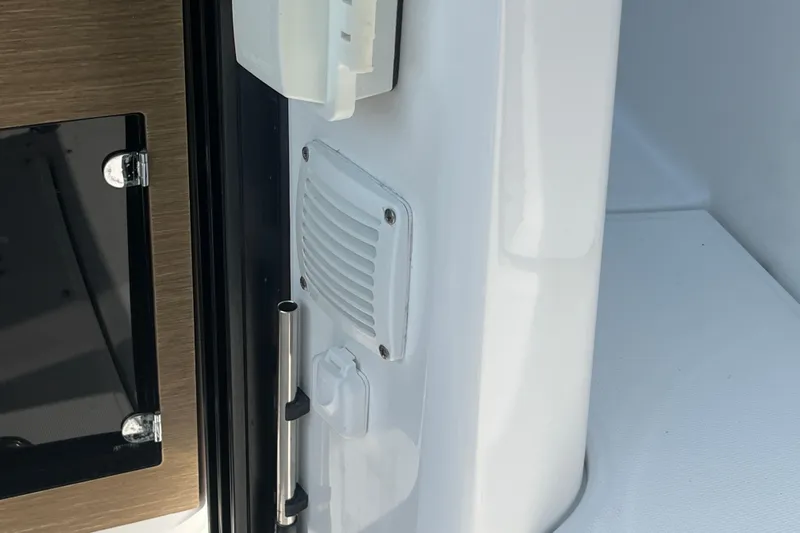  Yacht Photos Pics Interior detail of 2020 Jeanneau NC 895 boat, featuring a vent and handle.