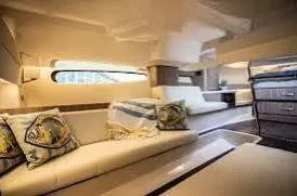  Yacht Photos Pics Luxurious interior of 2023 Regal Grande Coupe yacht with elegant seating and decor.