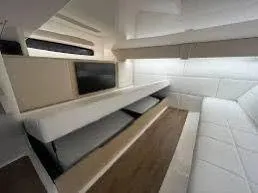  Yacht Photos Pics 2023 Regal Grande Coupe interior with modern seating and sleek design.