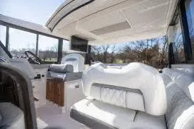  Yacht Photos Pics Luxurious interior of 2023 Regal Grande Coupe yacht with plush seating and modern design.