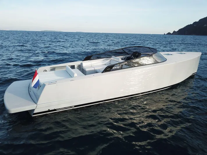  Yacht Photos Pics 2021 VanDutch 48 yacht cruising on open water, sleek design, modern luxury.
