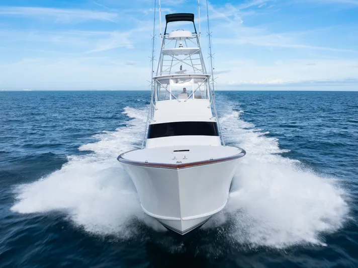 Smoke Show Yacht Photos Pics 1985 Monterey Convertible yacht cruising on open sea.